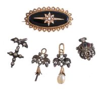 A late 19th century onyx and pearl brooch, the oval onyx panel set with an applied star set with