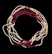 A cultured pearl and ruby necklace, the three strands composed of alternating 4mm cultured pearls