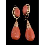 ϒ A pair of coral drop earrings, the coral drop polished to one side, the other side carved,
