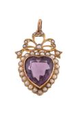 An Edwardian amethyst and seed pearl pendant, the heart shaped amethyst within a surround of seed