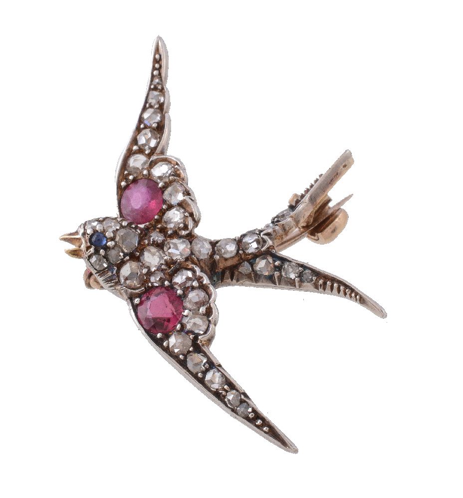 A late Victorian diamond, ruby and sapphire swallow brooch, circa 1890, set with rose cut diamonds