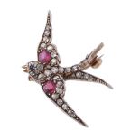 A late Victorian diamond, ruby and sapphire swallow brooch, circa 1890, set with rose cut diamonds