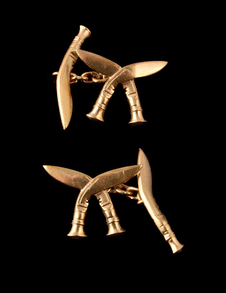 A pair of gold coloured Gurkha Regimental double sided cufflinks, designed as crossed khukuri and