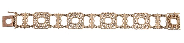 A fancy link bracelet, the pierced square panels to the concealed clasp, stamped 585, 18cm long,