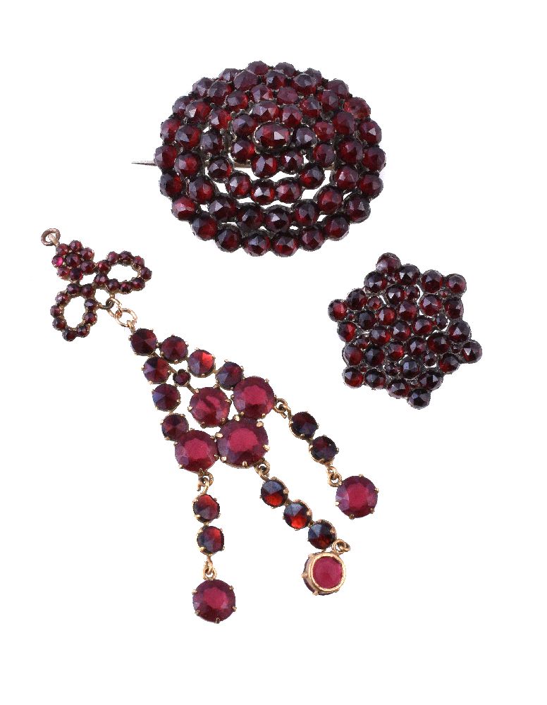 A late 19th century Bohemian garnet brooch, circa 1890, the oval brooch set throughout with rose cut