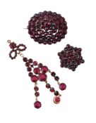 A late 19th century Bohemian garnet brooch, circa 1890, the oval brooch set throughout with rose cut