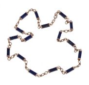 A 1970s lapis lazuli and gold coloured necklace, the rectangular lapis batons with gold coloured