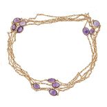 A gold coloured amethyst long chain, the fancy link chain set with oval cut amethysts, 155cm long,