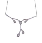 A white stone necklace, the drop panels set with round cut white stones, the panel stamped 585, to a