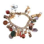 ϒ A charm bracelet, composed of curb links with various gem set and other charms, including: