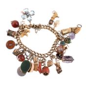 ϒ A charm bracelet, composed of curb links with various gem set and other charms, including: