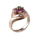 A ruby, diamond and emerald cluster ring, the central circular cut emerald within a surround of