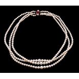 A three strand cultured pearl necklace, composed of graduating cultured pearls, measuring 3mm to