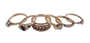 A small collection of gold coloured rings, to include a 14 carat gold ruby and diamond dress ring,