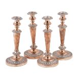A set of four old Sheffield plate circular candlesticks, circa 1830, 28cm (11in) high