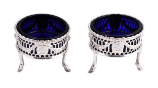 A pair of George III silver circular salt cellars, possibly by John Lambe, London 1771, with