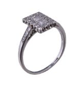 A 1930s diamond ring, the rectangular panel set with square cut diamonds within a surround of
