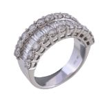 A diamond half eternity ring, the central channel set with baguette cut diamonds, between two rows