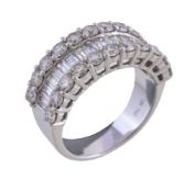 A diamond half eternity ring, the central channel set with baguette cut diamonds, between two rows