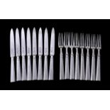 A set of eight Art Deco silver fruit knives and forks by The Goldsmiths & Silversmiths Co. Ltd,