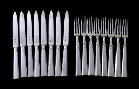 A set of eight Art Deco silver fruit knives and forks by The Goldsmiths & Silversmiths Co. Ltd,