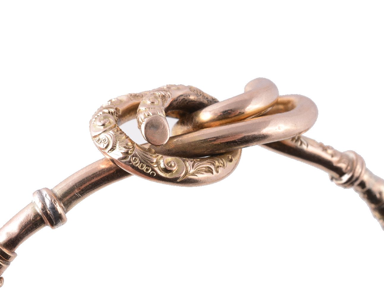 A Victorian 9 carat gold lover's knot bangle, with chased foliate detail, stamped 9ct, 6cm inner - Image 3 of 3