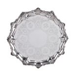 A Victorian silver shaped circular salver by Alexander Macrae, London 1859, with a shell and