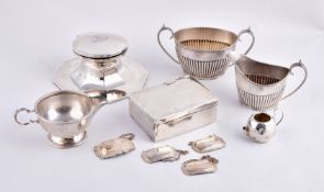 A collection of silver, including: an octagonal large capstan inkwell by A. & J. Zimmerman,