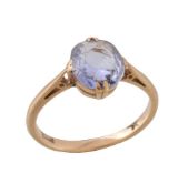 An early 20th century sapphire ring, the oval cut sapphire in a claw setting, stamped 18ct, finger