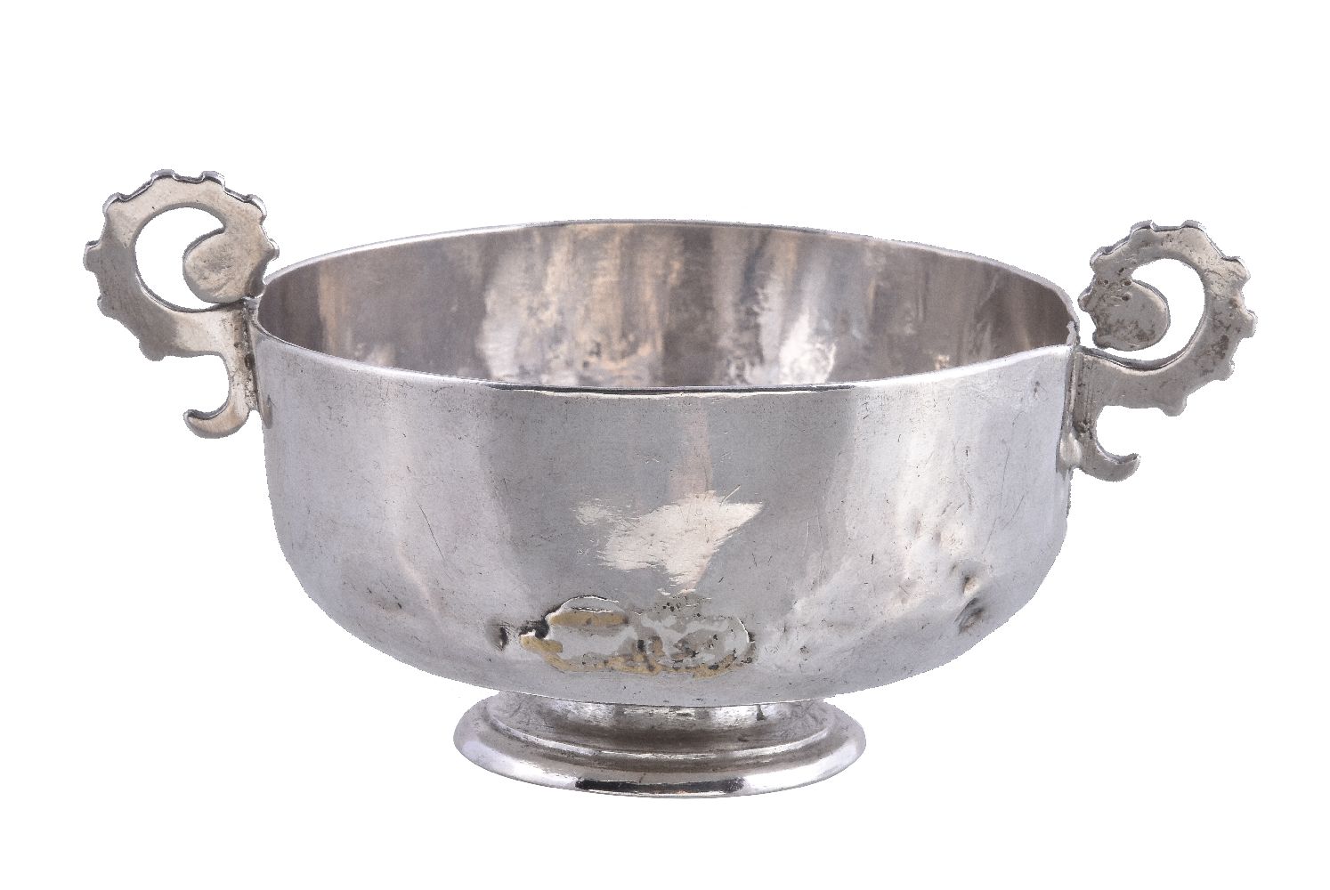 A silver twin handled cup, unmarked, probably English late 17th century, with shaped scroll handles,
