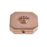 A gem set gold coloured canted-rectangular pill box, stamped 18K, circa 1950, the cover with an