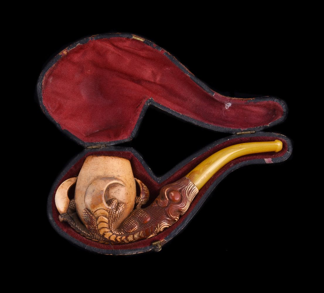 A meerschaum pipe, early 20th century, carved as an eagle's talon holding an egg, with an amber - Image 2 of 3