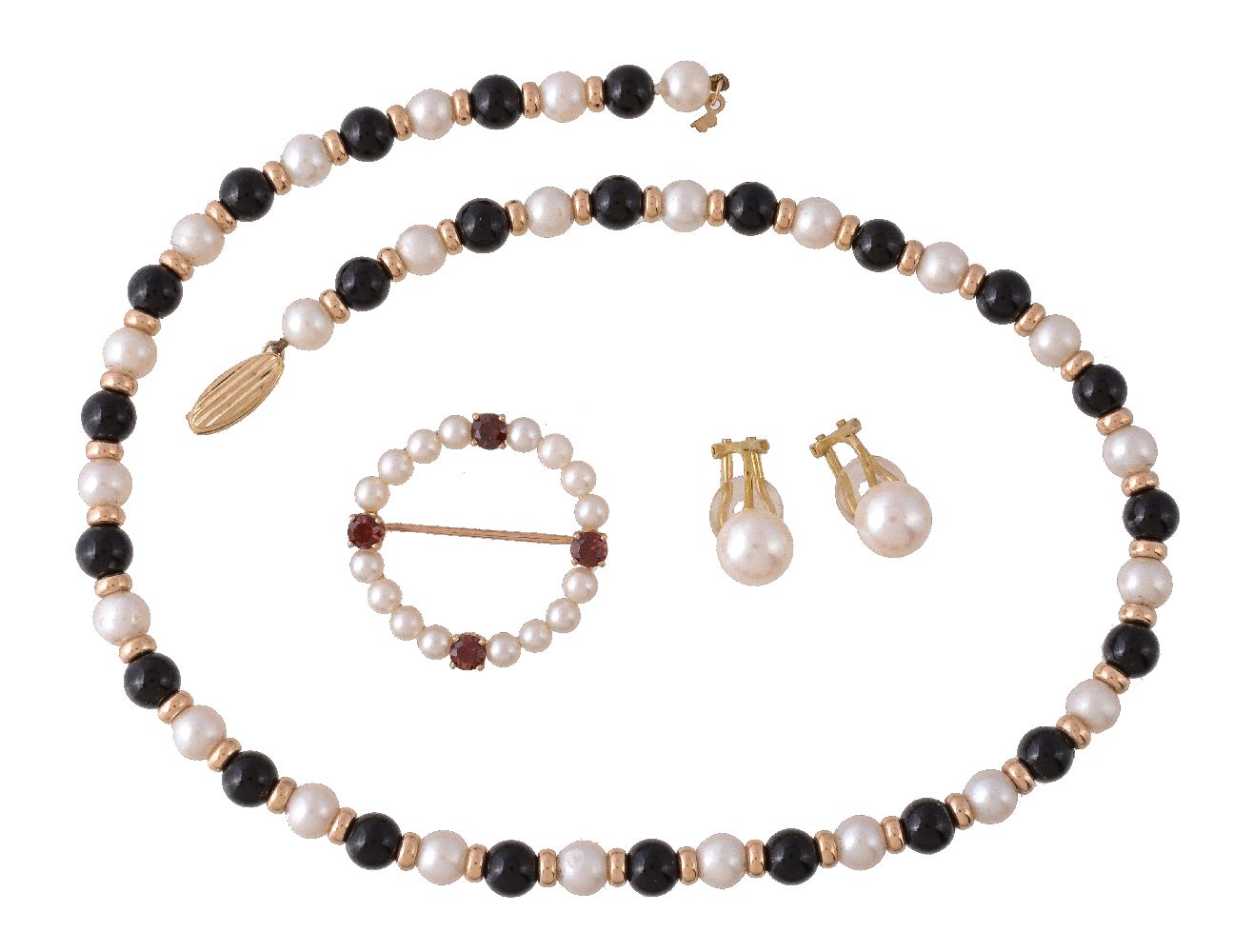 A cultured pearl and garnet brooch, the circlet of cultured pearls with four circular cut garnets,