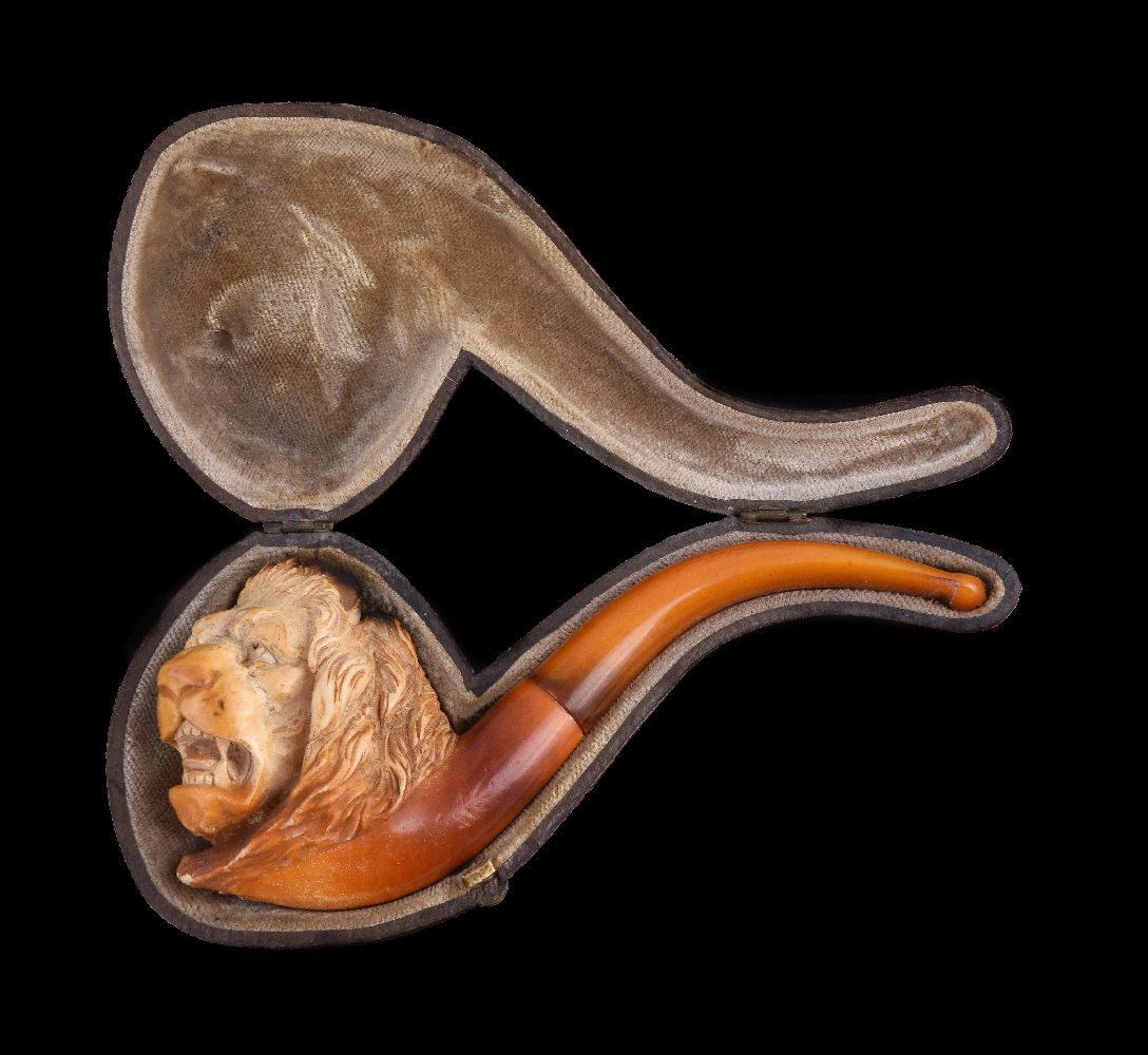 A meerschaum pipe, 20th century, carved as a lion's head, with an amber mouthpiece, 14cm (5 1/2in) - Image 2 of 3