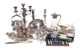 A collection of plated wares, including: a mounted clear glass claret jug; an oval revolving