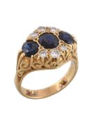 A sapphire and diamond dress ring, the three graduated oval cut sapphires with two trios of
