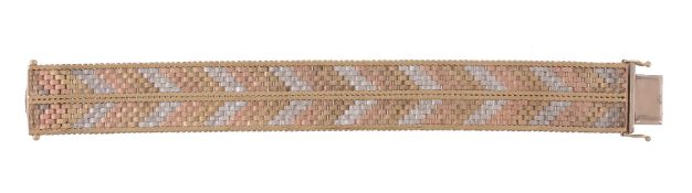 A 9 carat gold three colour bracelet, the broad bracelet composed textured brick and chevron