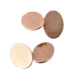 A pair of gold coloured cufflinks, the oval panels with engraved initials, with belcher link