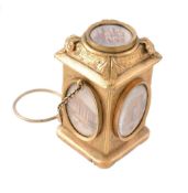 A late 19th century French gilt metal, painted miniature and carnelian scent bottle, the shaped