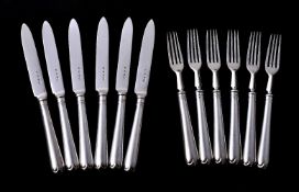 A set of six silver old English pattern fruit knives and forks by The Goldsmiths & Silversmiths