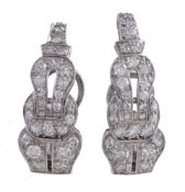 A pair of diamond earrings, the curved panels set with eight cut diamonds, approximately 0.90 carats