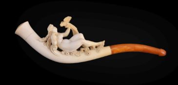 A meerschaum erotic cheroot pipe, 20th century, carved with a reclining nude maiden holding aloft