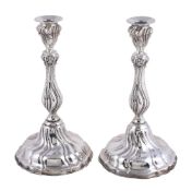 A pair of Spanish silver shaped circular candlesticks, maker's mark a device, post 1934 .915