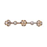 A diamond and half pearl brooch, the clusters of old cut diamonds, approximately 1.20 carats