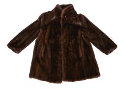 A half length brown mink fur coat