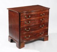 A George III serpentine fronted chest of drawers