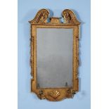 A George II giltwood and gesso girandole wall mirror