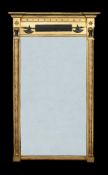A Regency giltwood, gesso and ebonised wall mirror