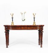 A pair of George IV figured mahogany side tables
