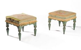 A pair of green painted and parcel gilt foot stools, in Gothic revival taste